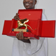 Malick Sidibé poses with his Golden Lion Award on June 10, 2007, during the 52nd Venice Biennale in Italy.
SEBASTIANO CASELLATI/AFP/Getty Images
